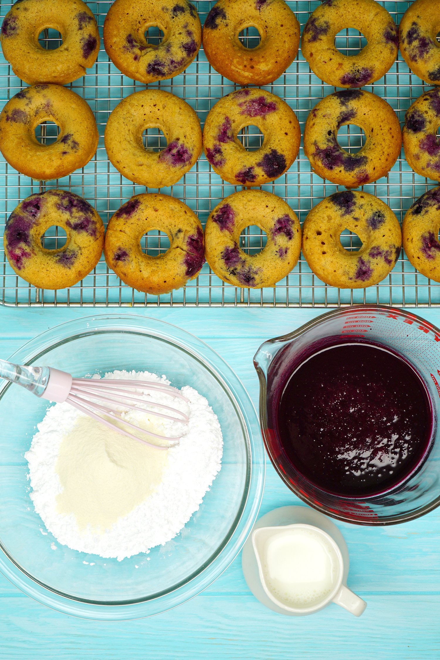 mixing blueberry glaze for donuts