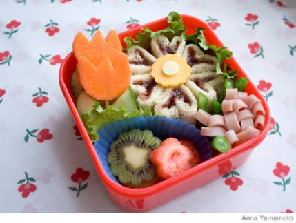 bento box flowers made from fruits and snacks