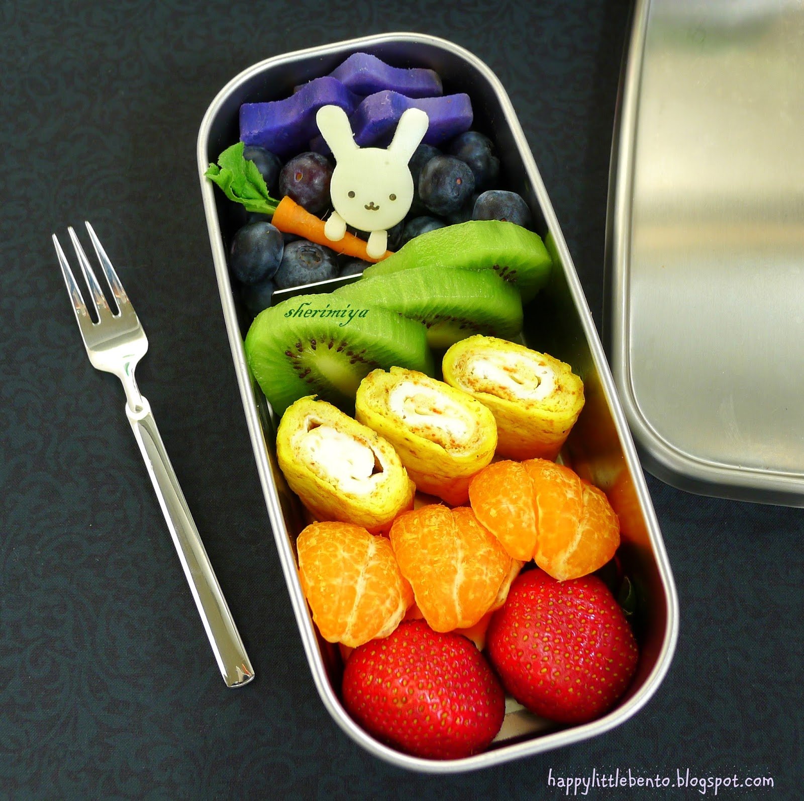 colorful fruit rainbow box with bunny rabbit character inside