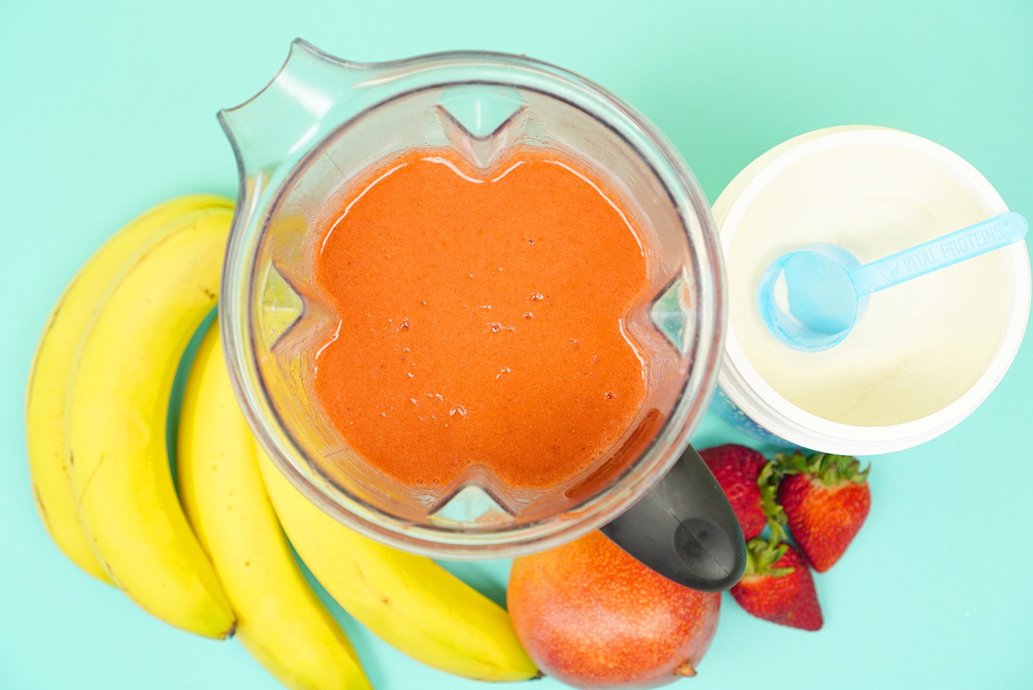 blended ingredients in blender with fruit pictured 