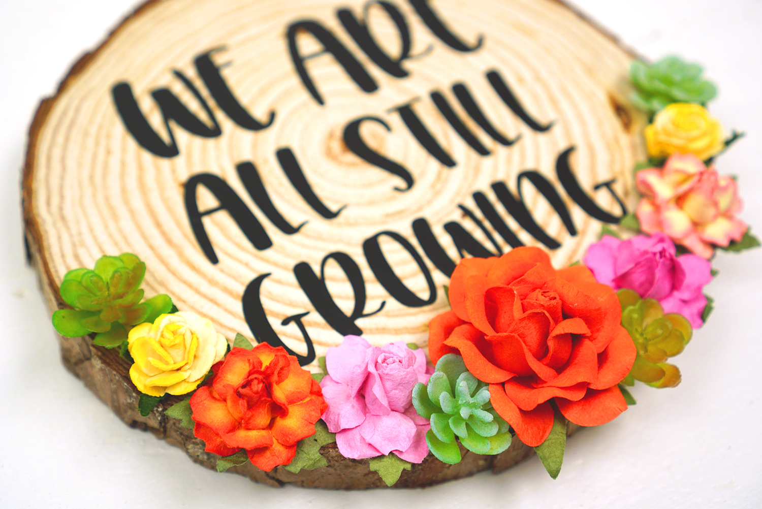 flowers adhered to beautiful wooden sign