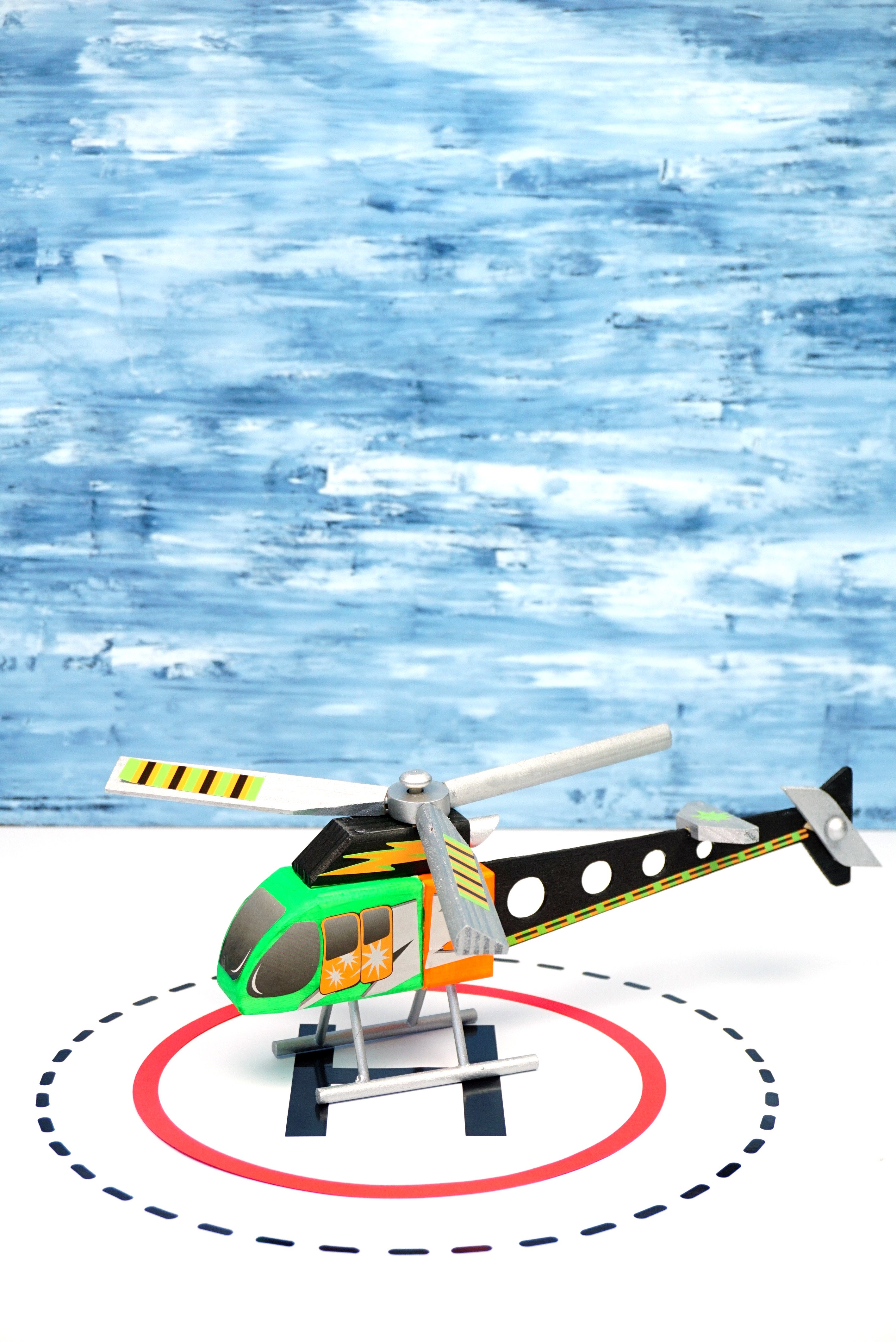 fun helicopter woodworking toy created on helipad 