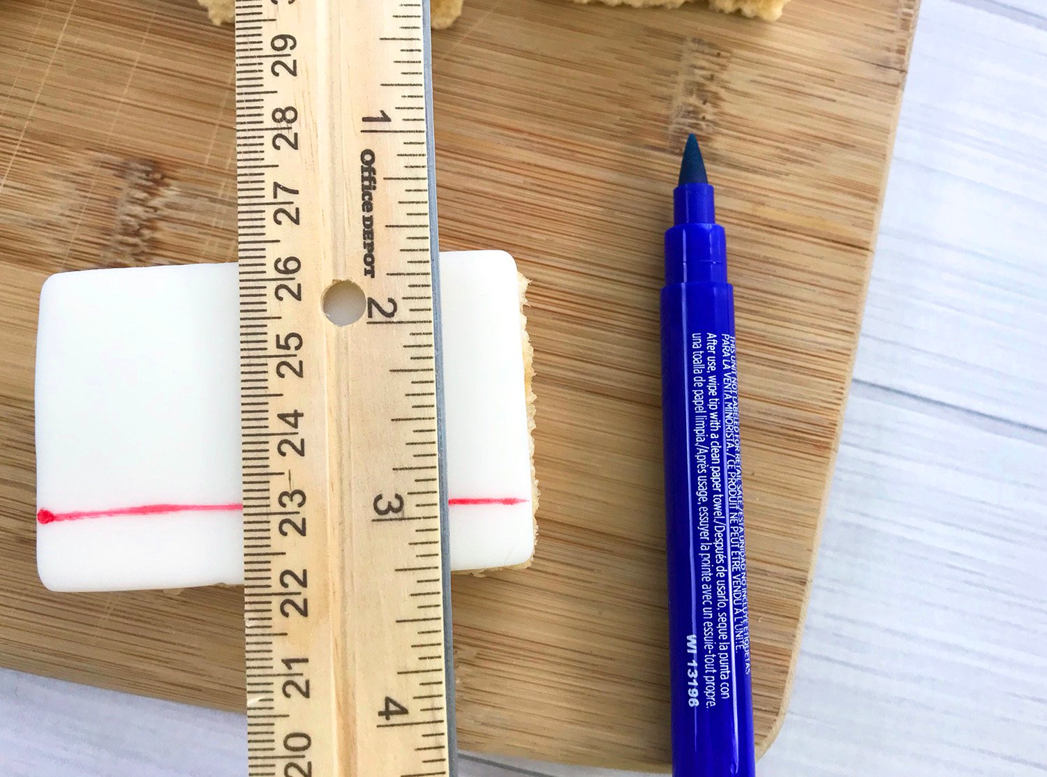 edible pen and ruler measuring lines onto rice krispie fondant 