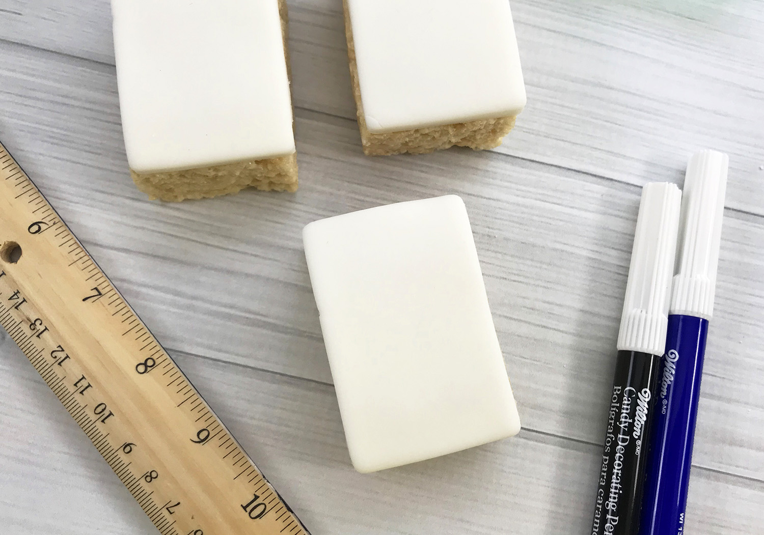 white fondant rectangles covering rice krispie squares