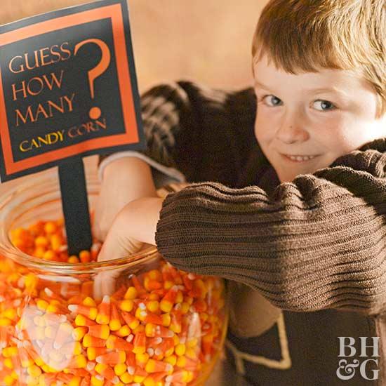 child playing guess how many candy corn game
