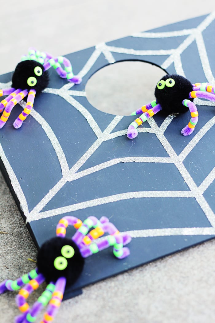 halloween cornhole game with spiders