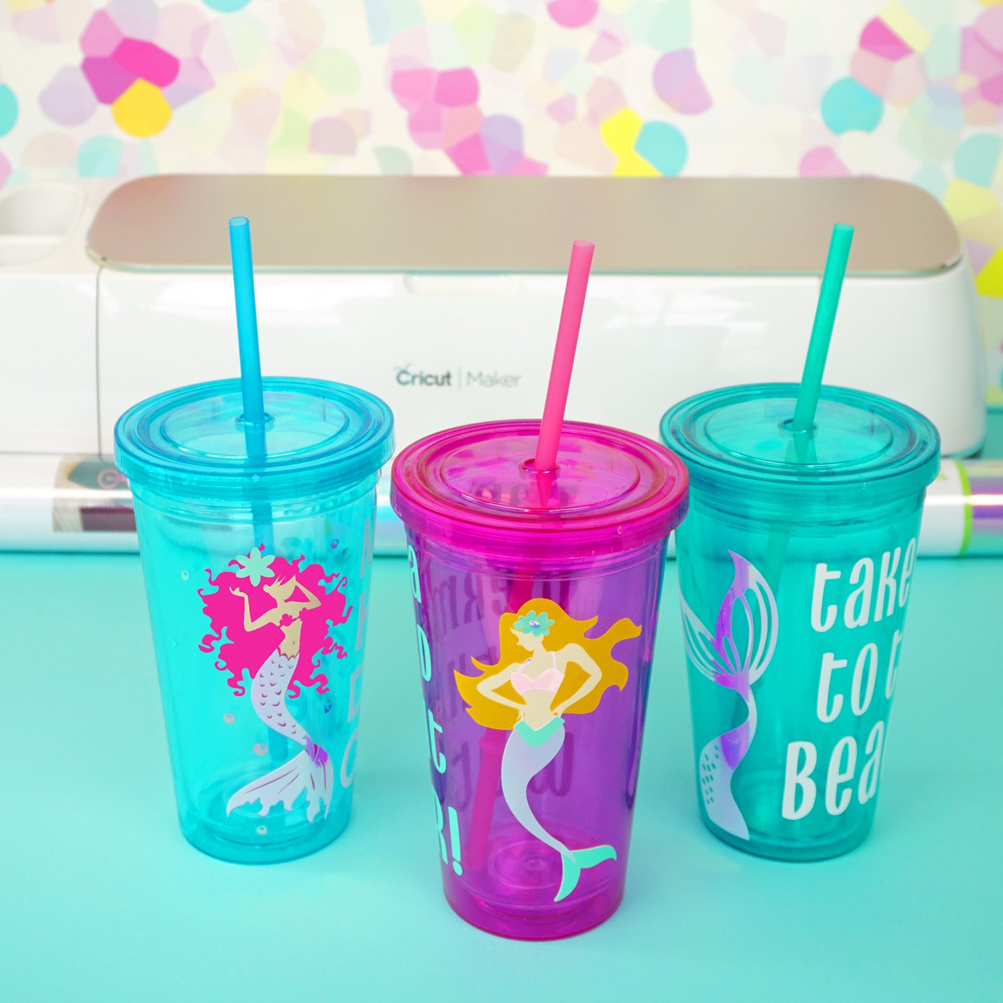 mermaid tumblers in front of cricut machine