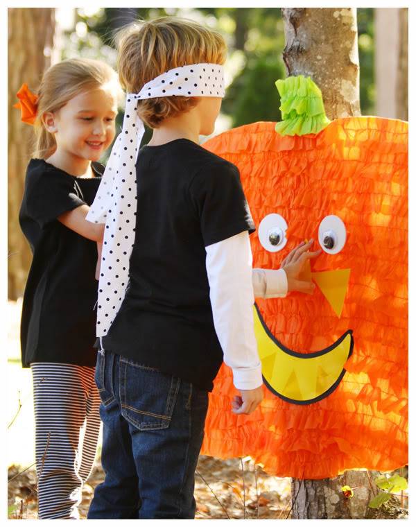 pin the face on the pumpkin game played by kids 