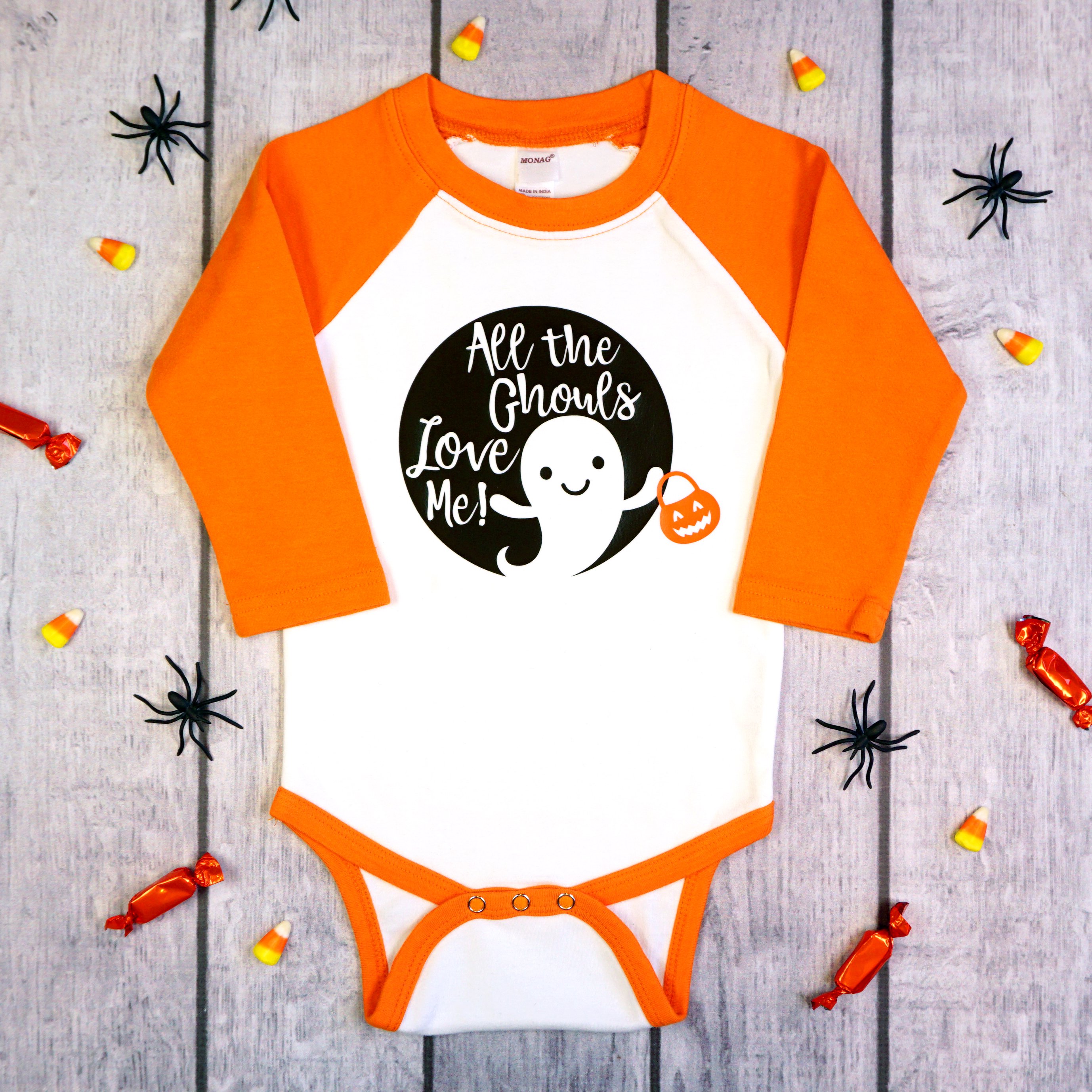 all the ghouls love me halloween svg file on onesie