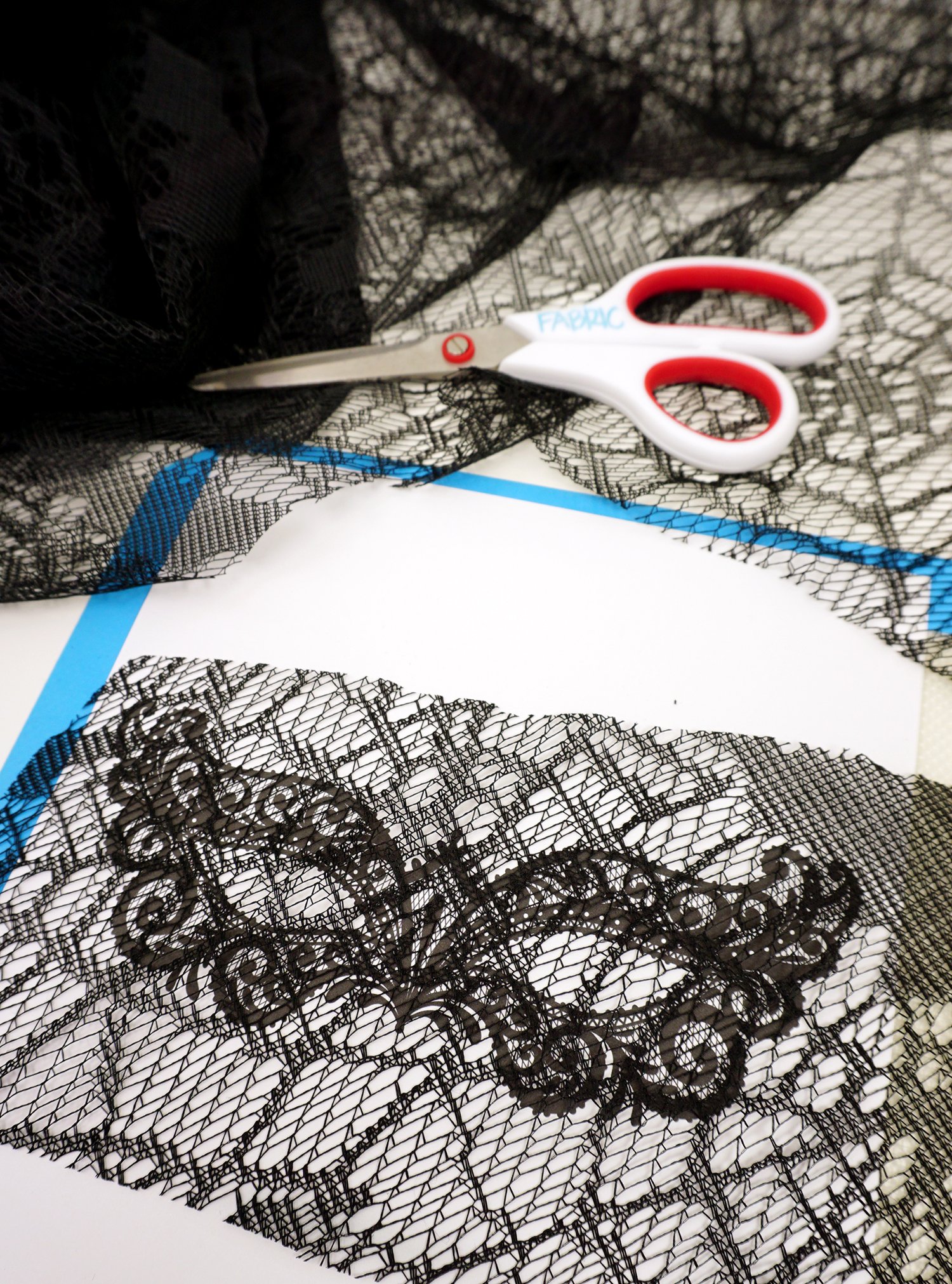 lace overlapping mask and scissors
