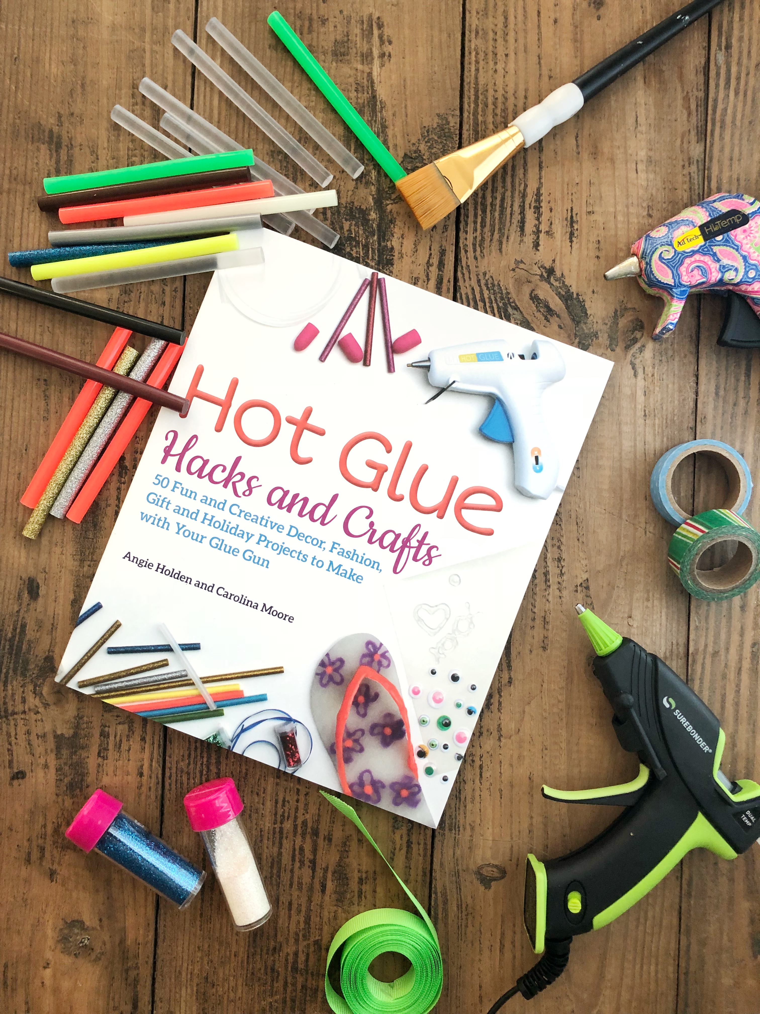 hot glue hacks and crafts book with craft supplies