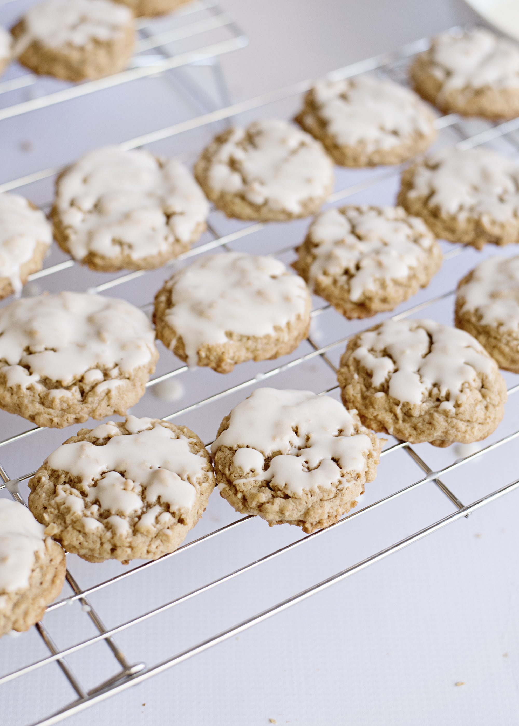 iced oatmeal cookies cooling on rack