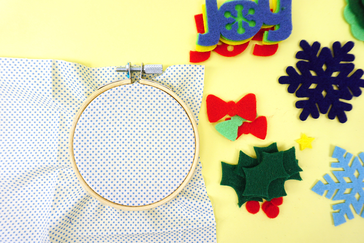 embroidery hoops with fabric stretched and cut pieces