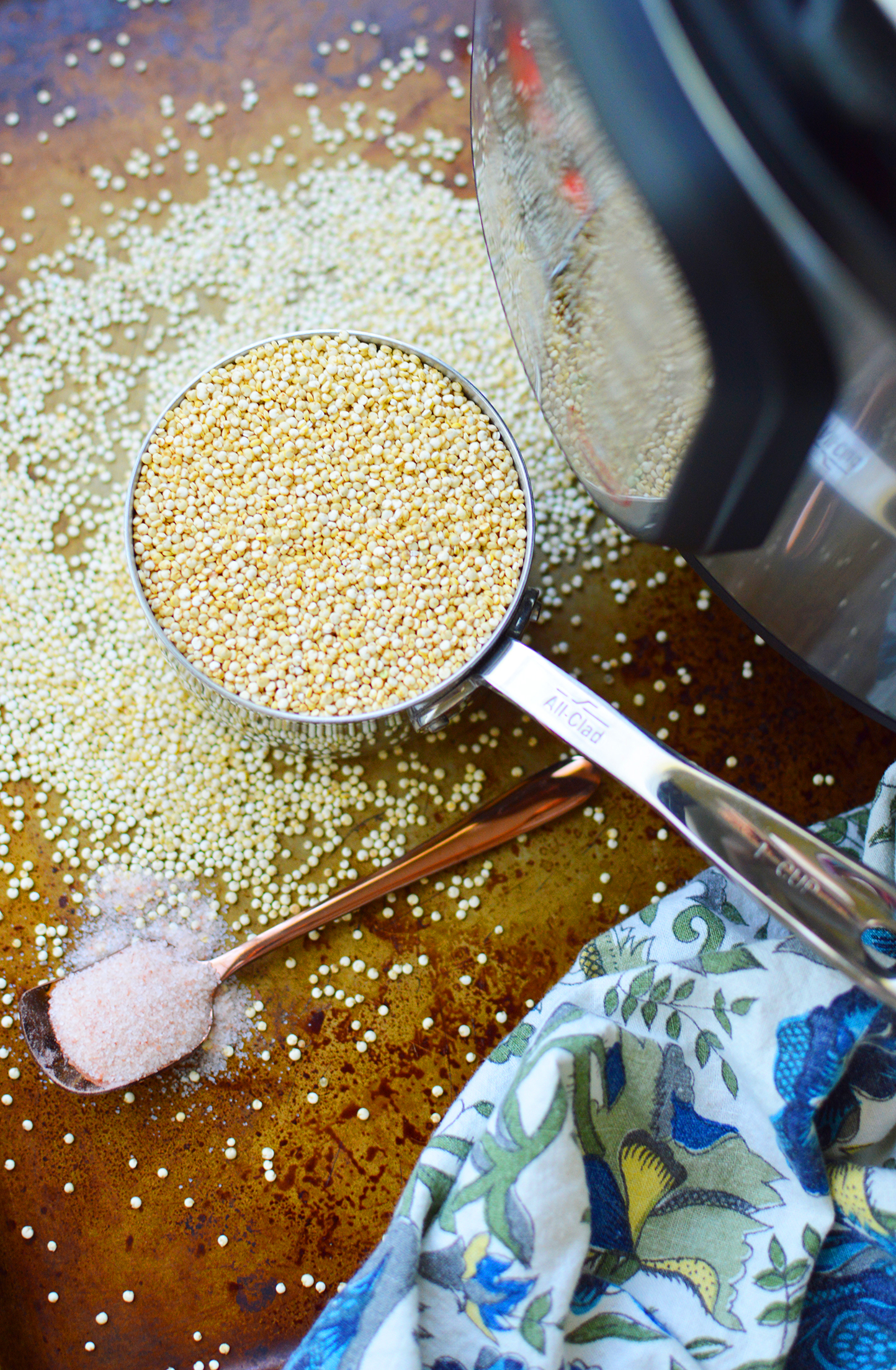 Cup of Uncooked Quinoa Next to an Instant Pot