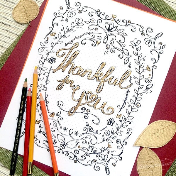 "Thankful for You" Thanksgiving coloring page with colored pencils on fall colored background with leaves