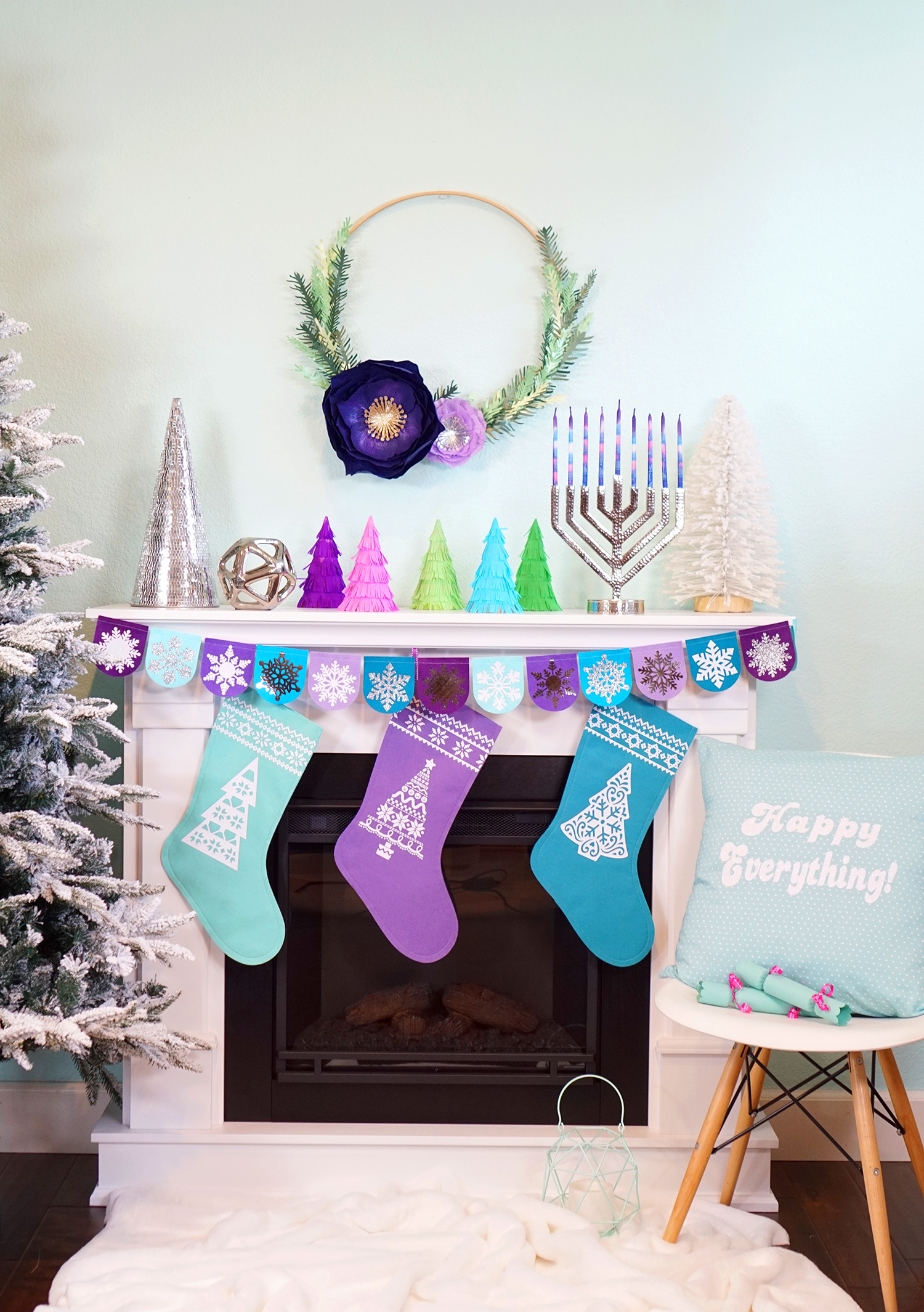 cute decorated christmas and hanukkah fireplace with small christmas tree