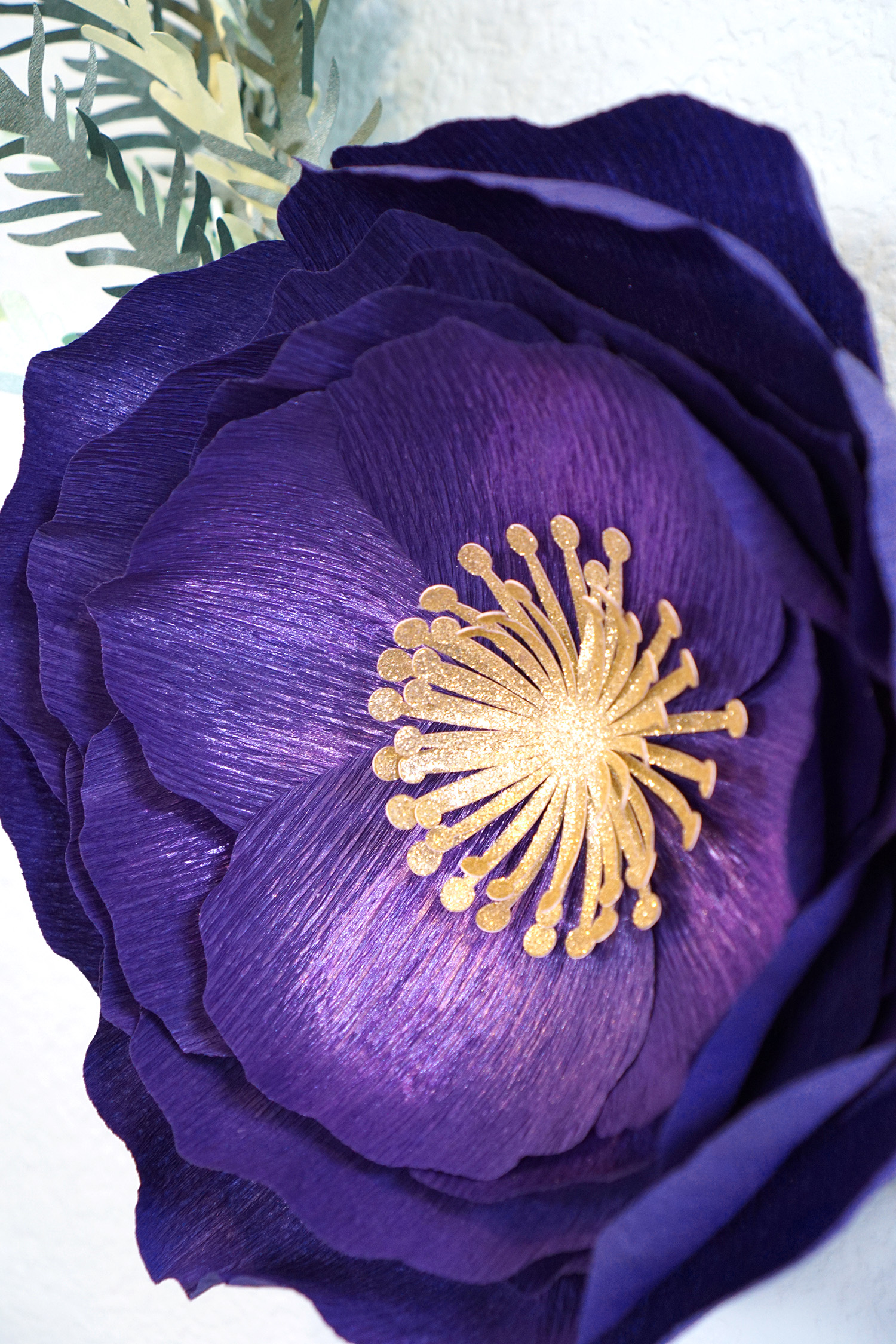 pretty purple and gold crepe paper flower 