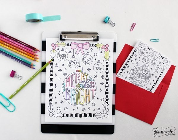 merry and bright coloring sheet on clipboard with pencils