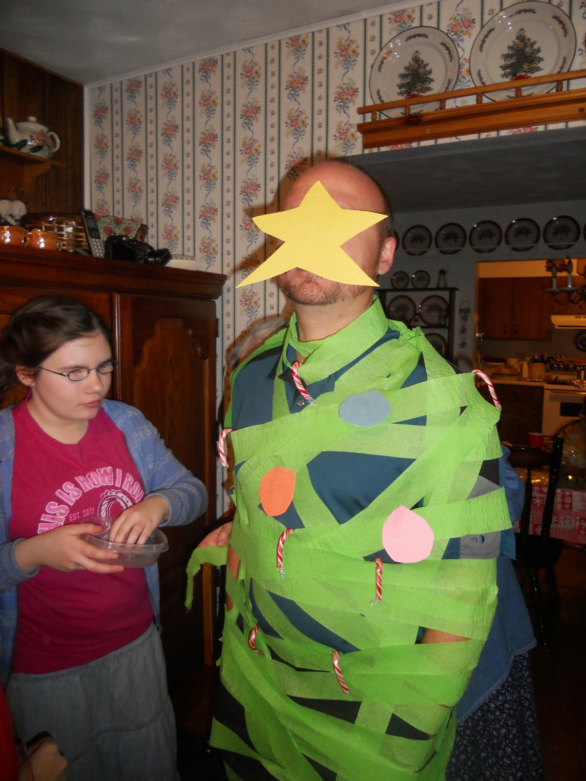 man dressed as a christmas tree