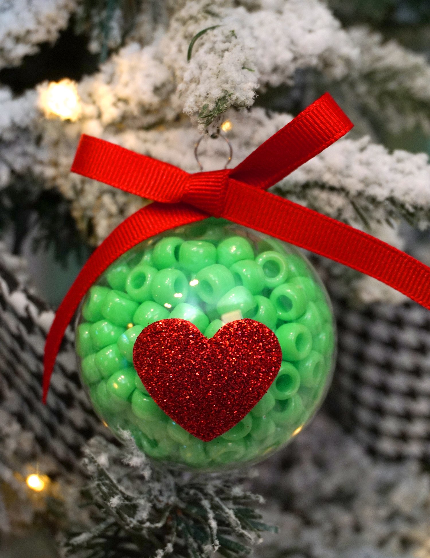 cute grinch heart ornaments on tree
