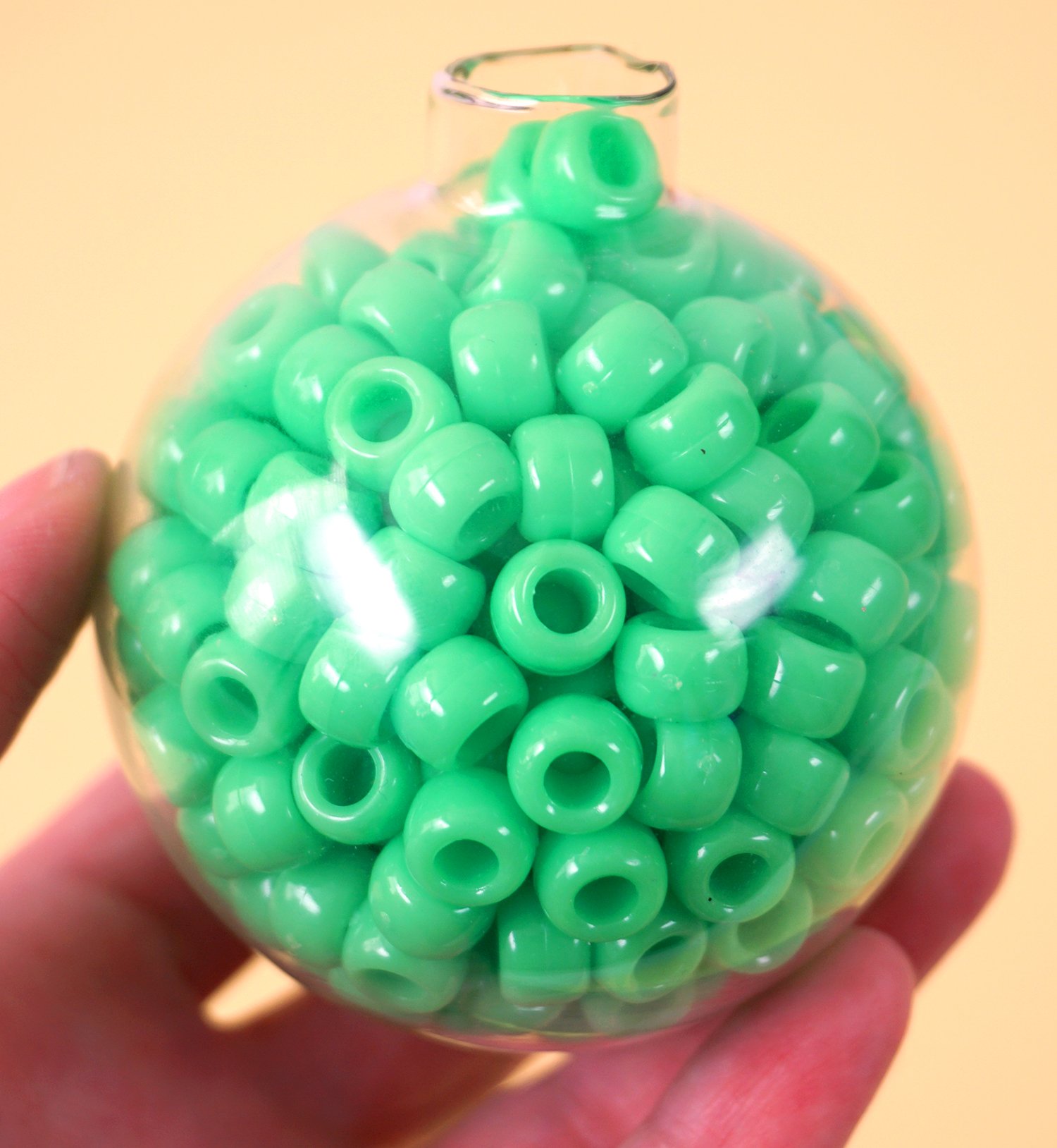 clear ornament stuffer with green beads