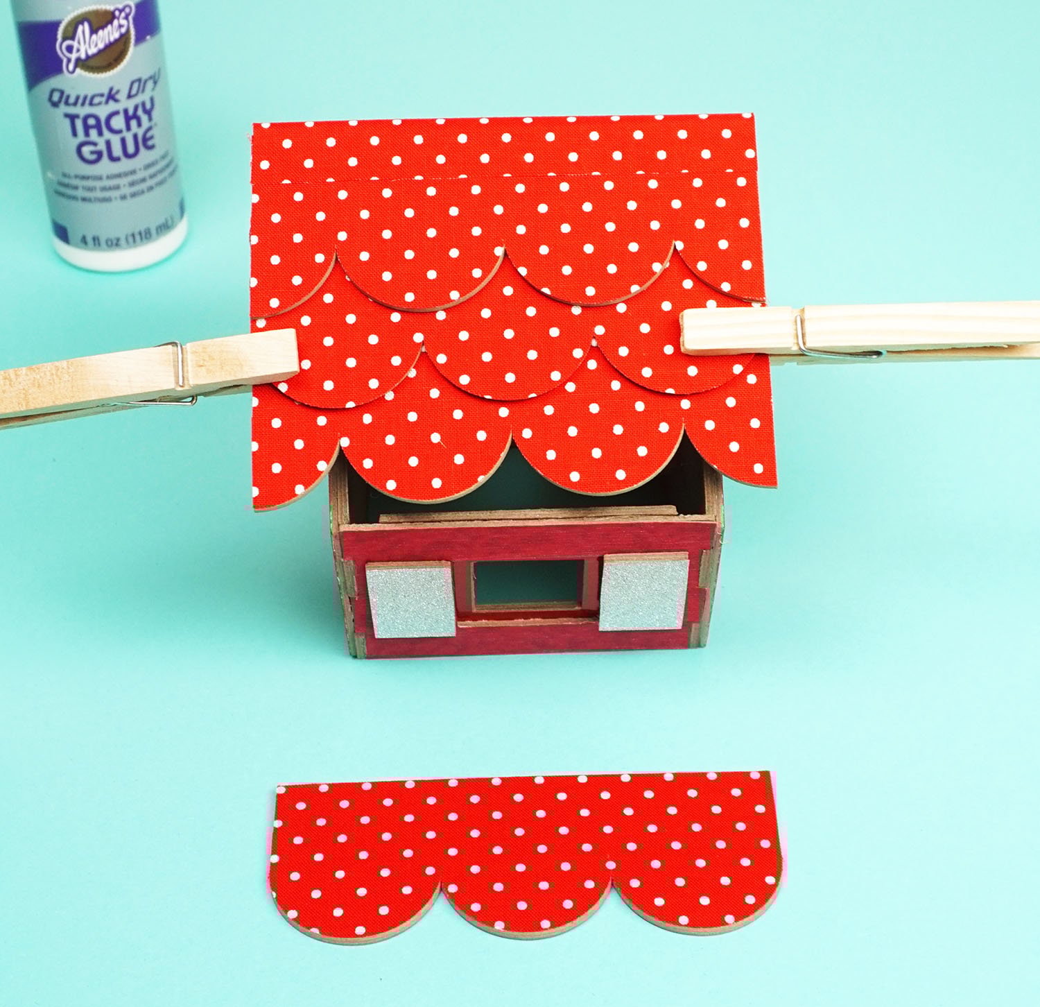 clamping sides of bird house with clothespins