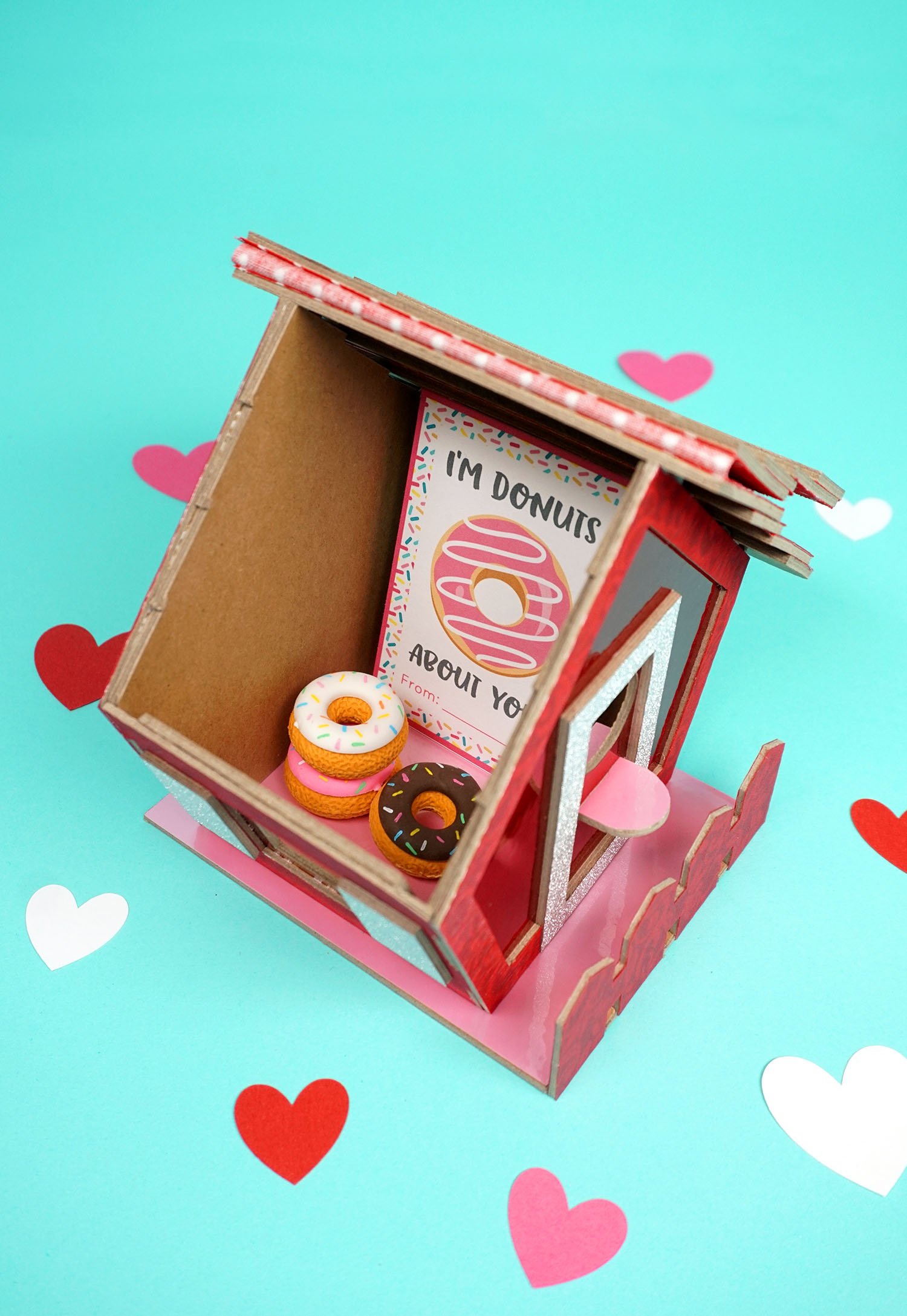 card box filled with donuts and donut valentines