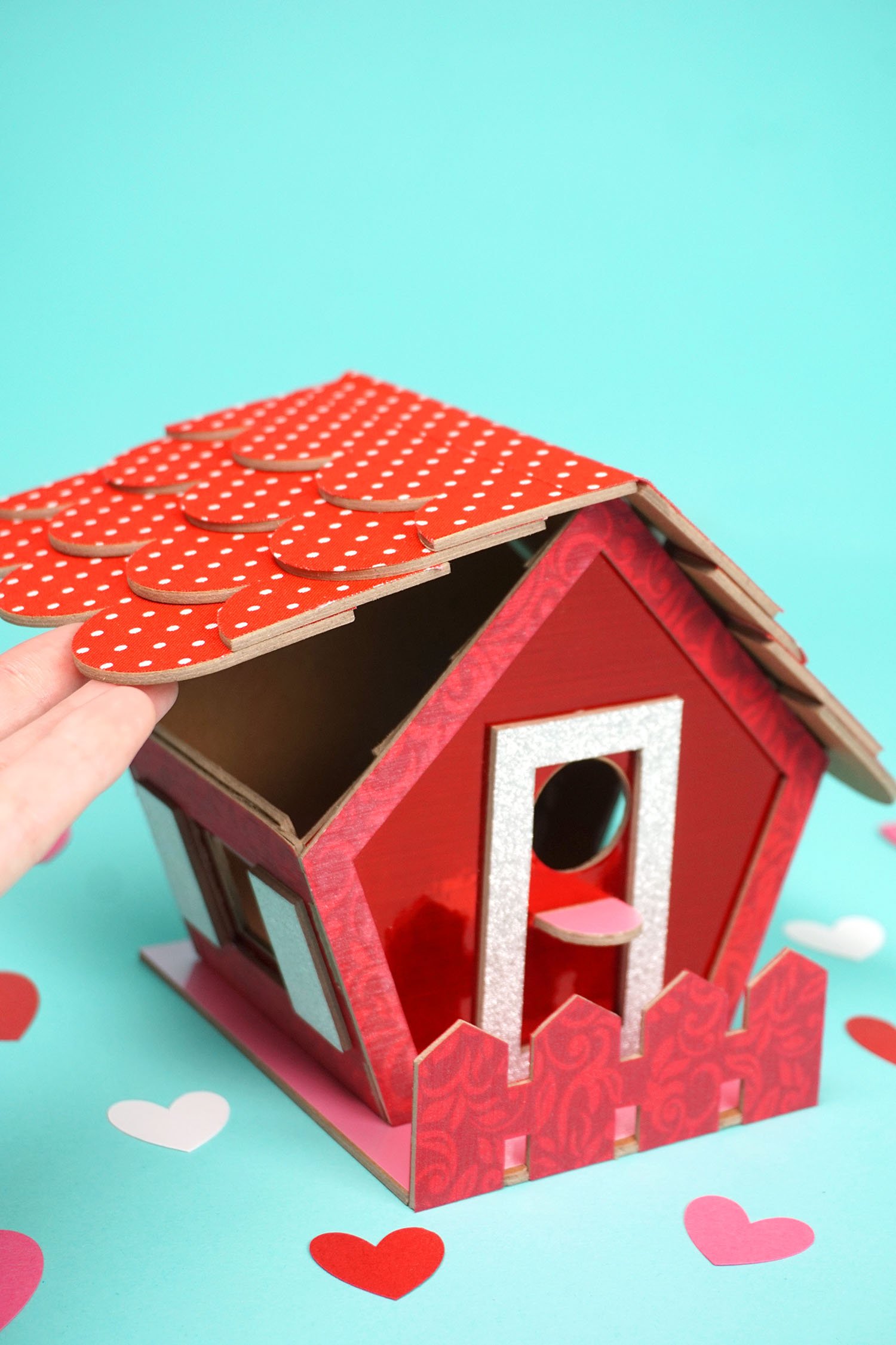 hinged roof opened on birdhouse