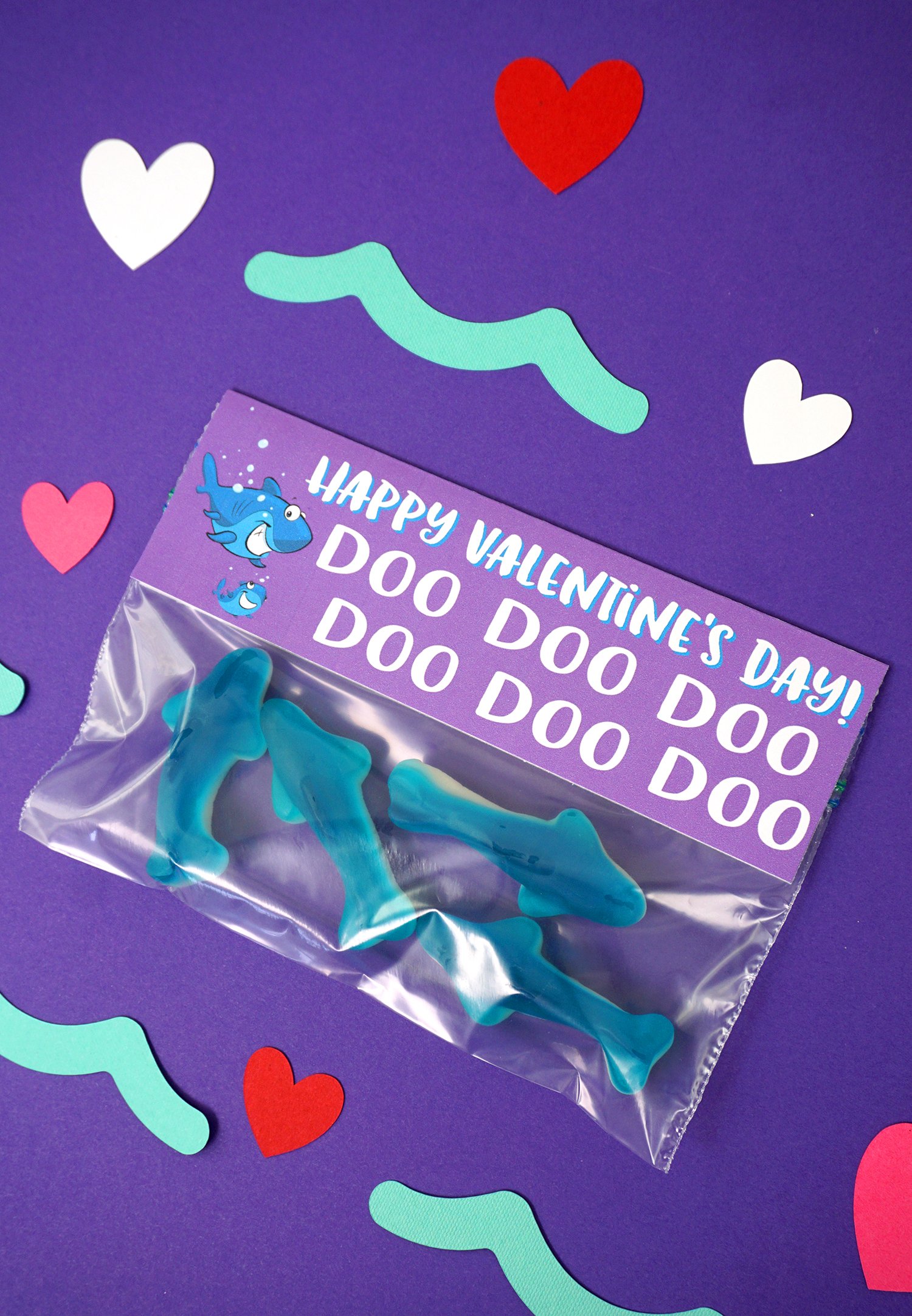 Baby Shark Valentine's Day Treat: Are your kids obsessed with Baby Shark? Take their love to the next level with these FREE Baby Shark Printable Valentines Cards! Baby Shark Valentine's Day Treat on Purple Background