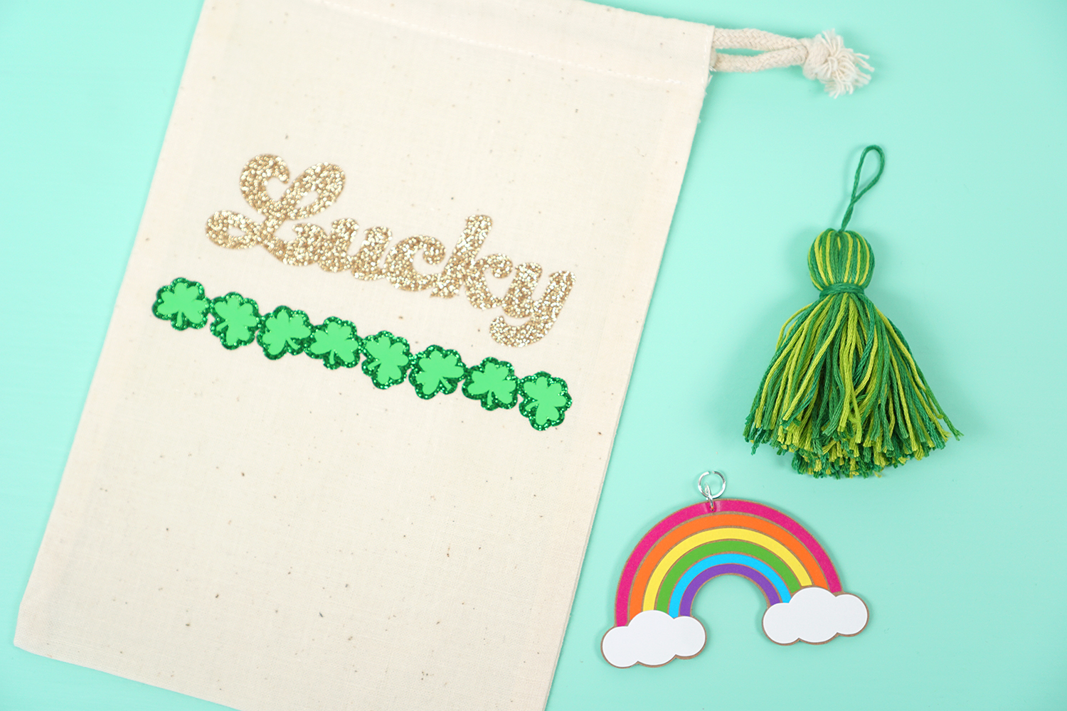 tassel and rainbow charm placed next to treat bag