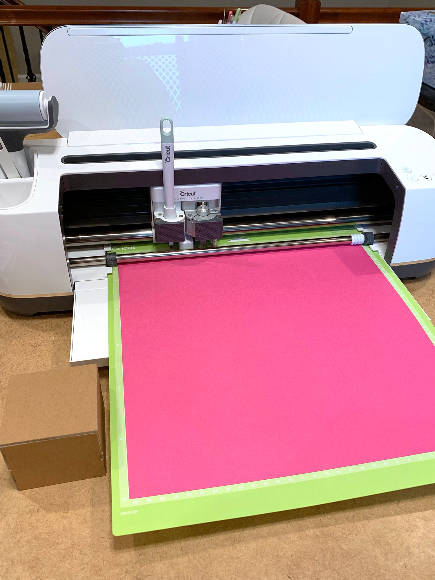 cricut maker with pink cardstock 