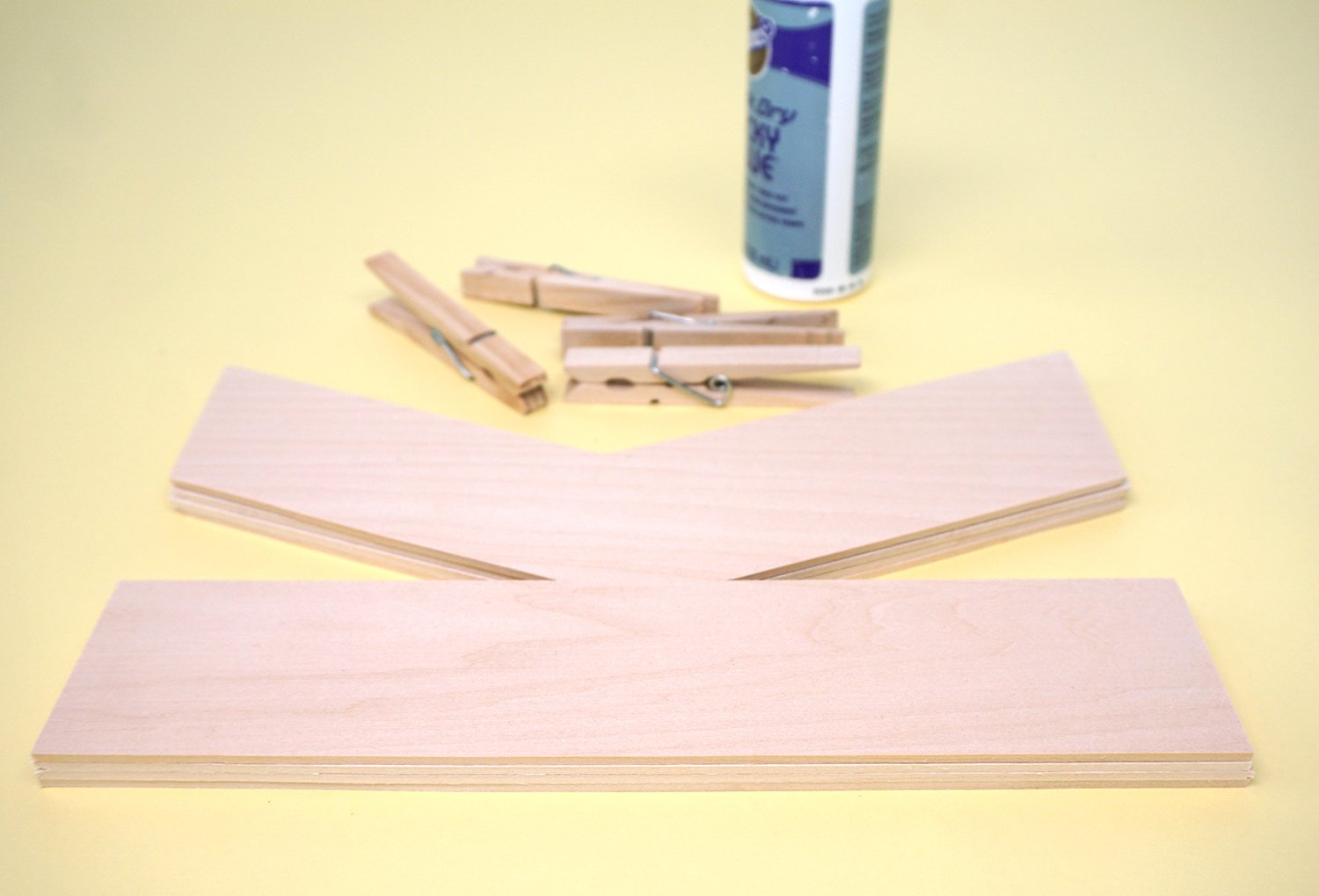 basswood letters layered with clothespins and glue