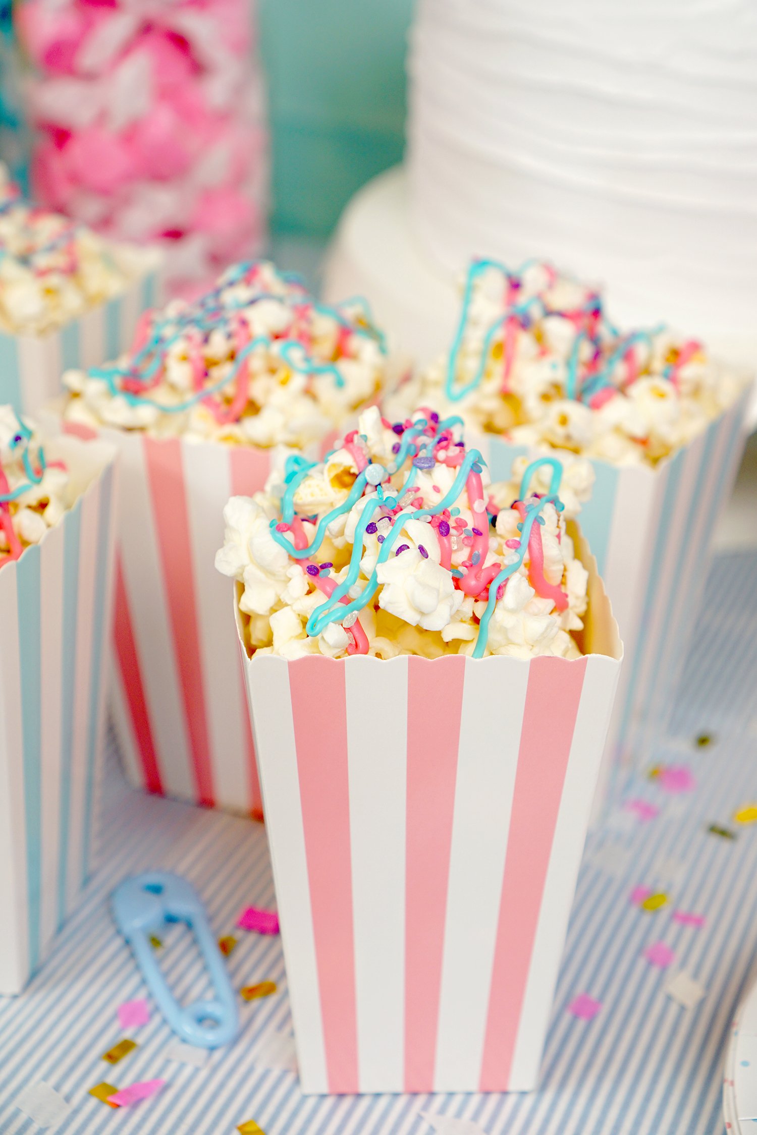 party popcorn topped with pink and blue icing