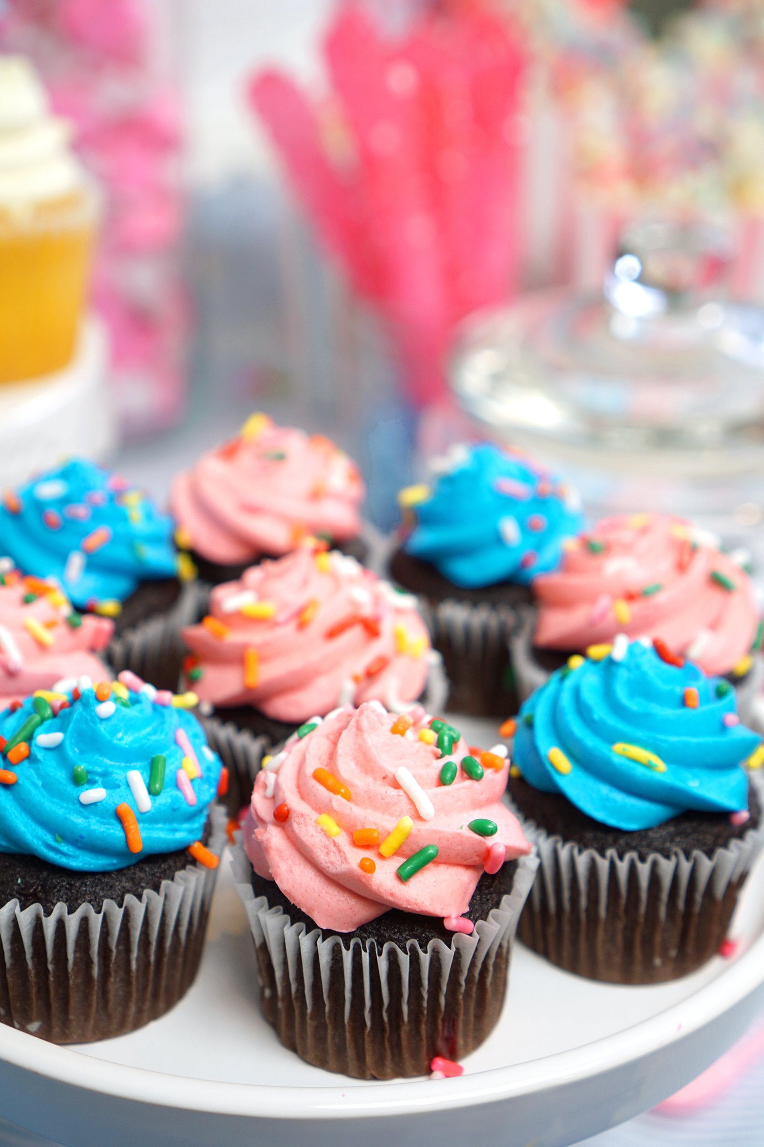 cupcakes decorated with pink and blue icing