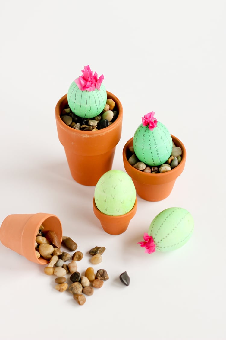 tiny easter eggs planted and decorated to look like cacti 
