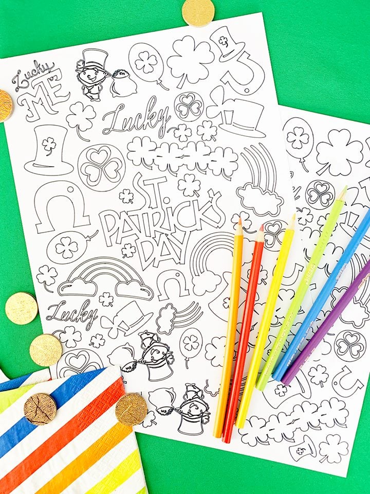 a pair of St. Patrick\'s Day coloring pages with colored pencils and coins