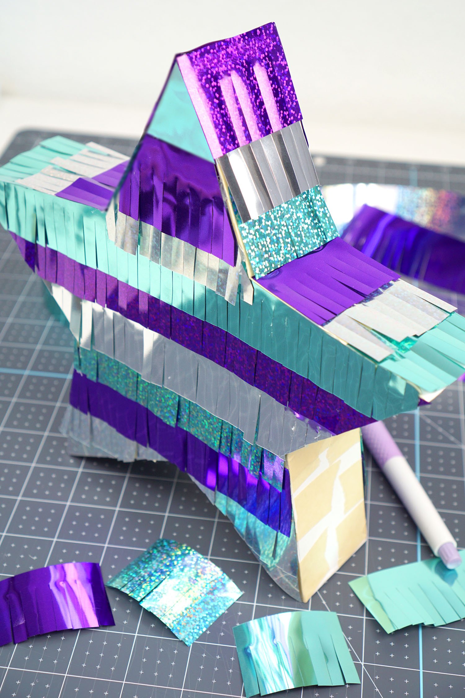 finished star shaped pinata being constructed