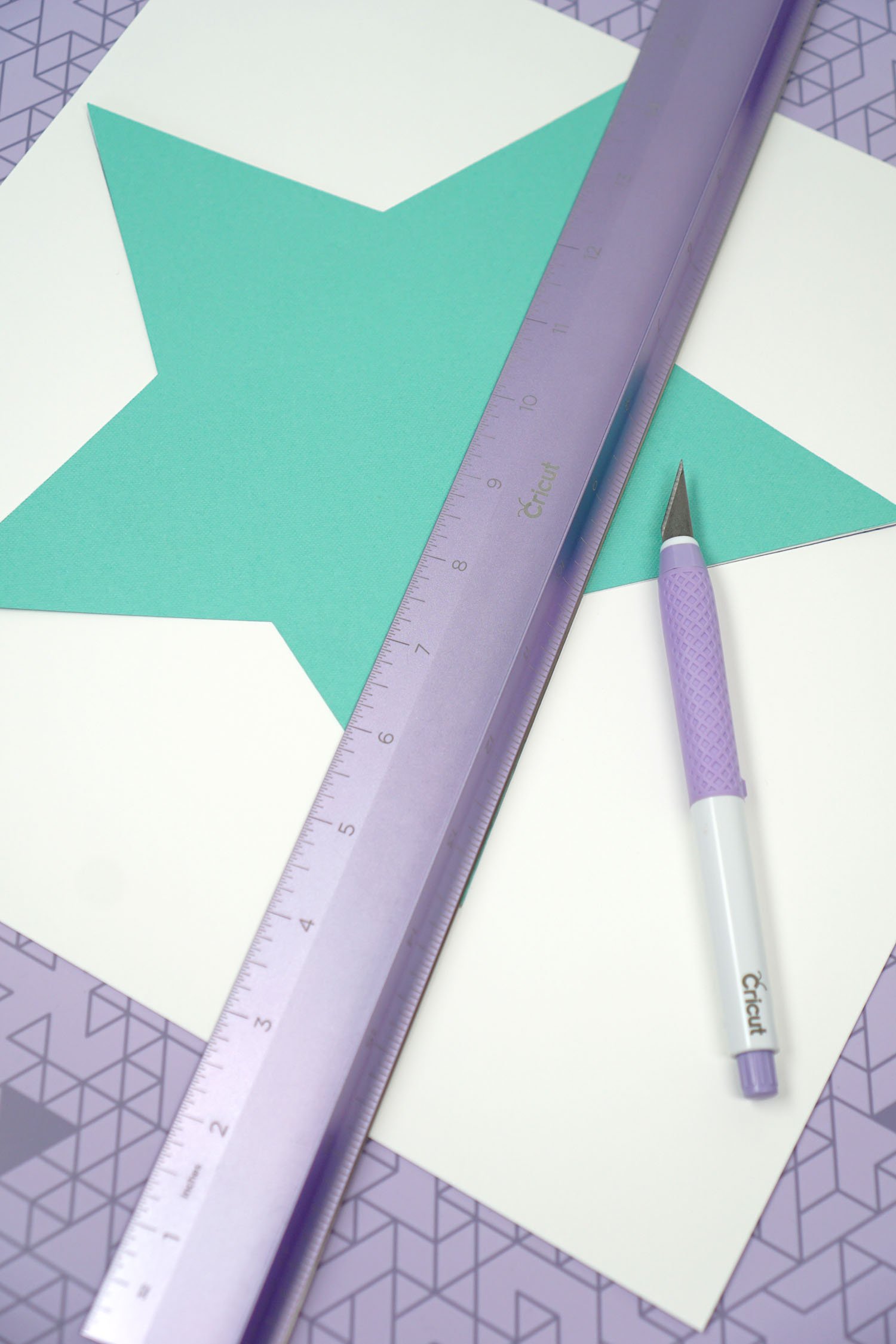 stars cut for DIY pinata craft with ruler and true control knife pictured