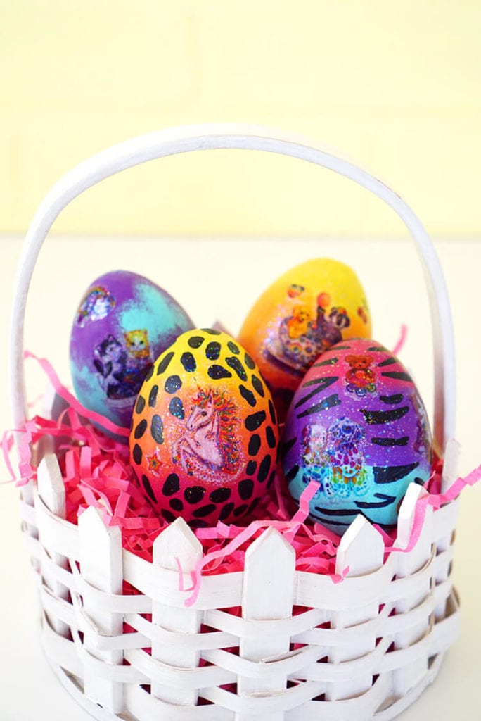 easter eggs colored with lisa frank inspired decoration in white basket