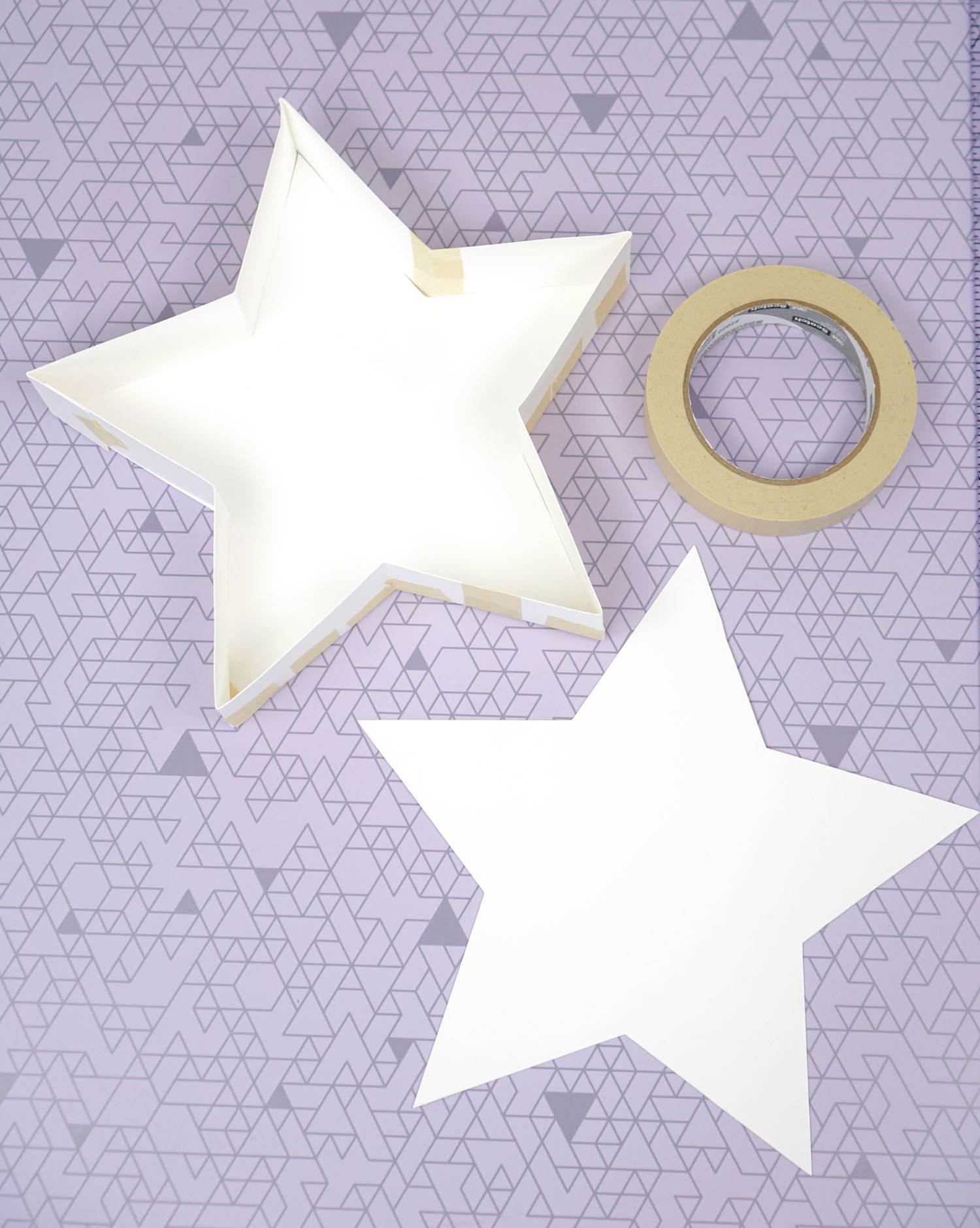empty star made from kraft board with top of star set aside