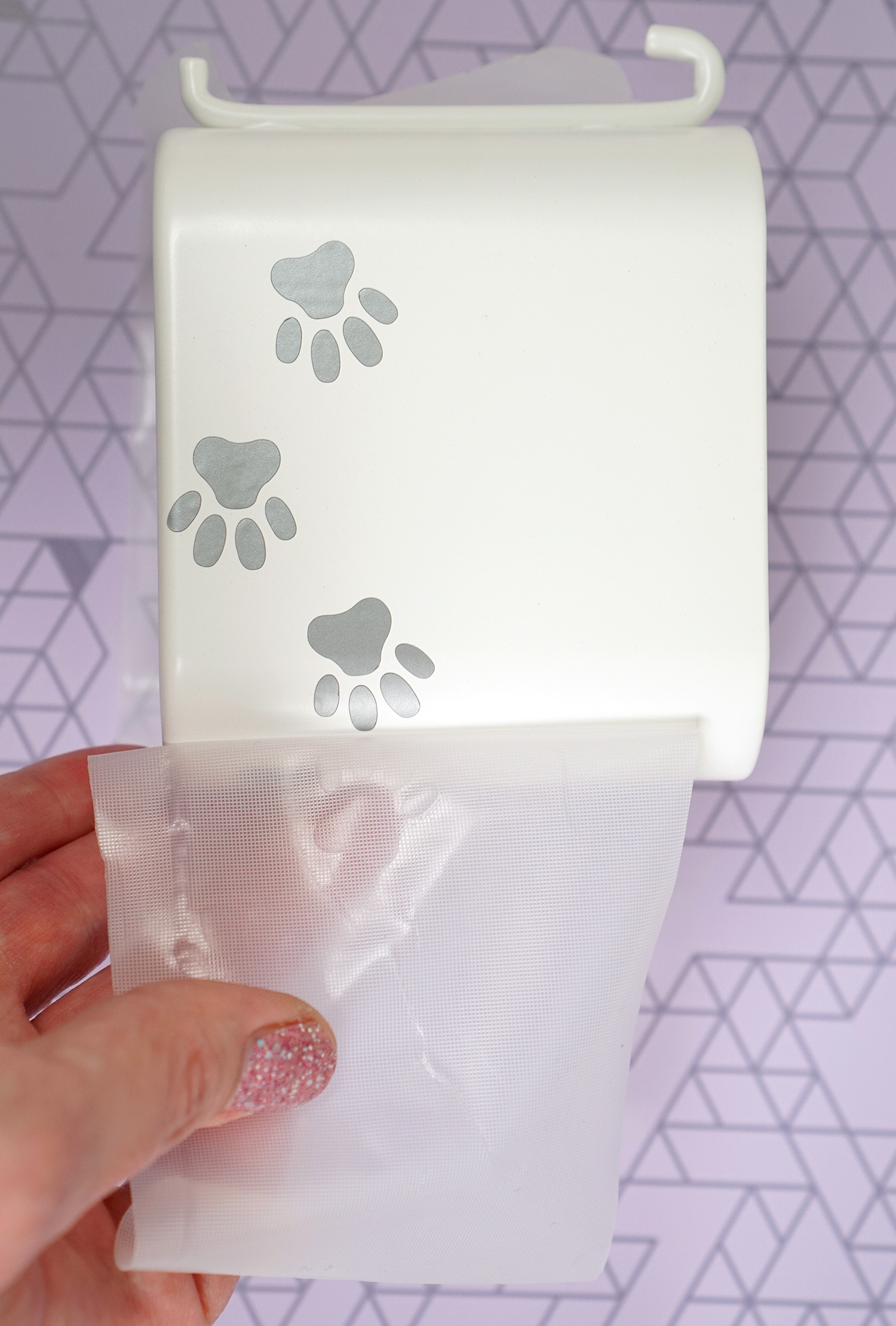 peeling transfer tape off of paw print vinyl