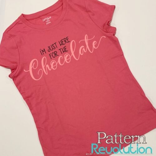 pink shirt that reads "I'm just here for the chocolate"