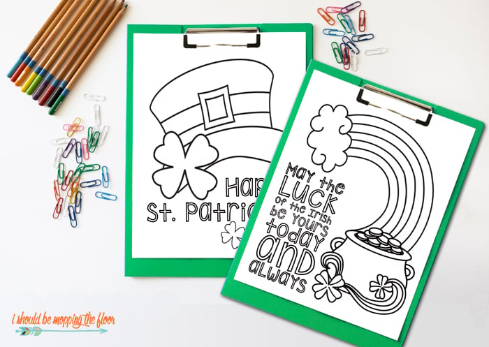 two st patrick\'s day coloring pages next to crayons