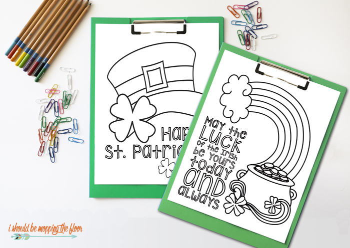 two st patrick\'s day coloring pages next to crayons