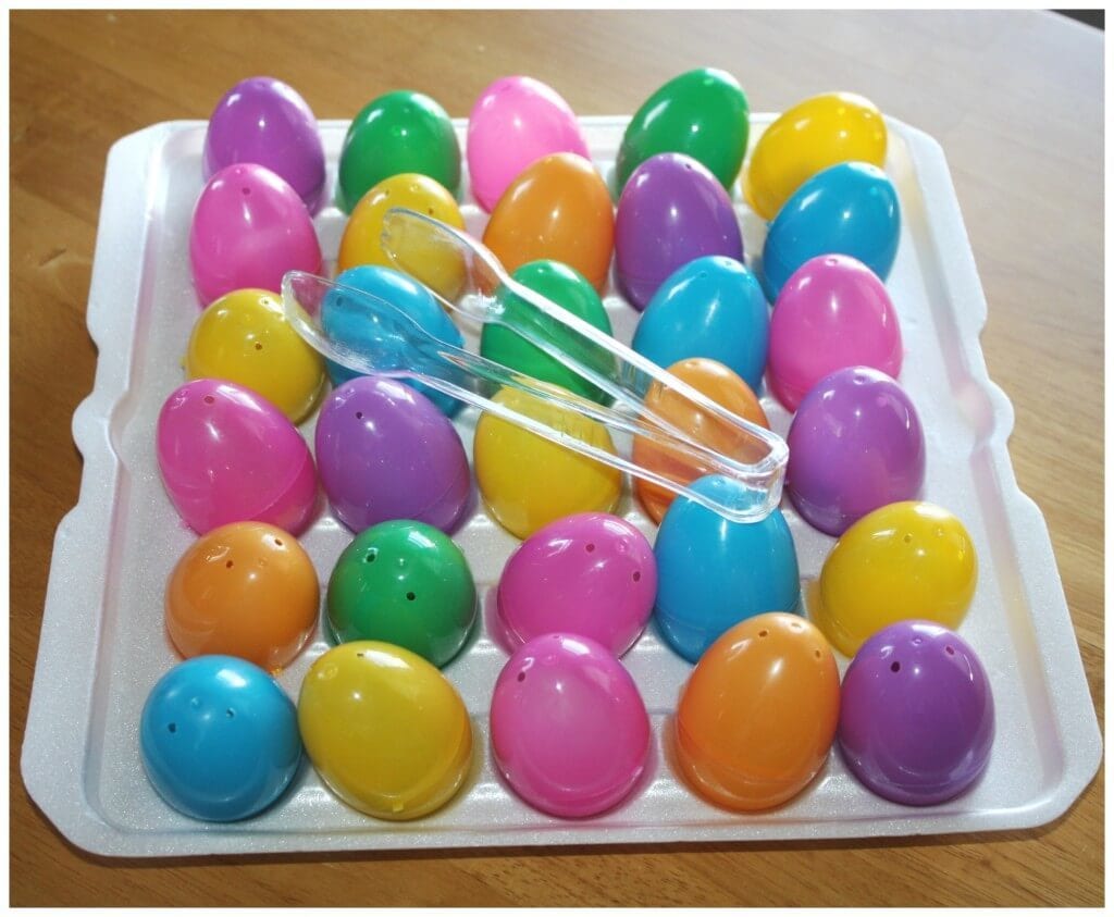 plastic easter eggs and a pair of tongs