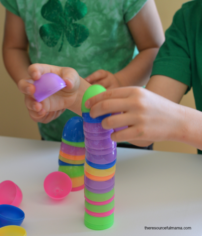 plastic easter eggs being stacked by small children