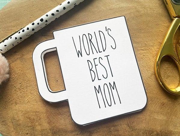 "World's Best Mom" printed on a plain white coffee mug card