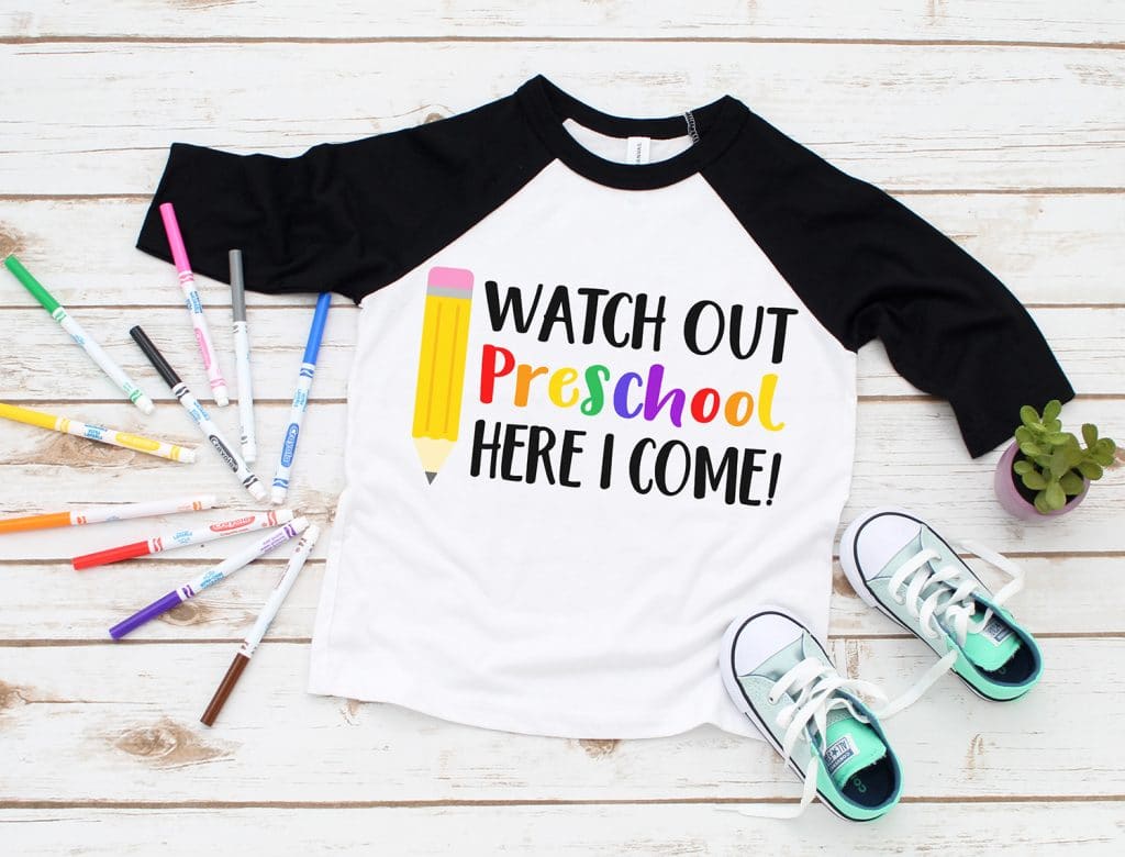 \"Watch Out Preschool Here I Come\" SVG on black raglan shirt surrounded by colorful markers and kids shoes