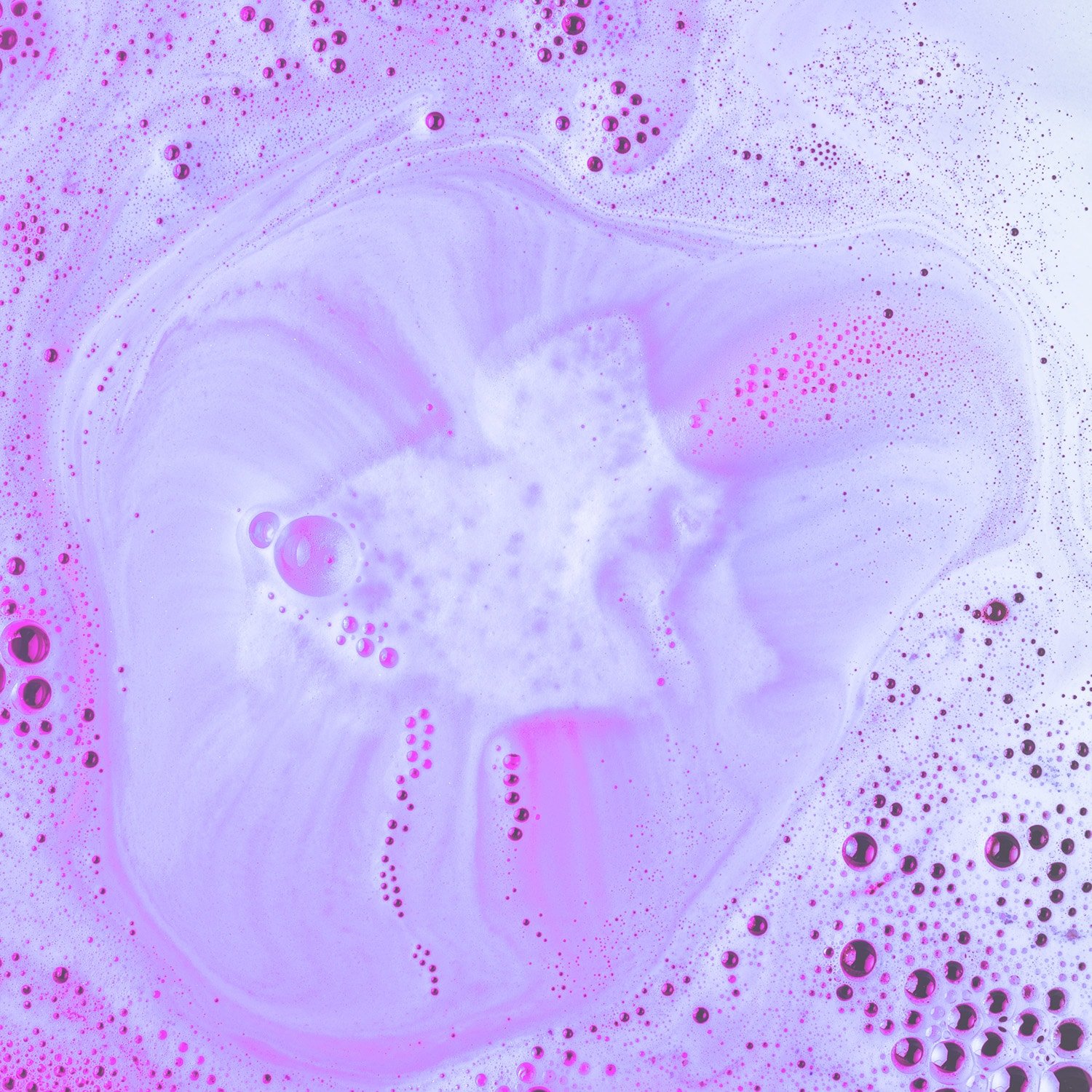 purple and pink hued bath bomb fizz