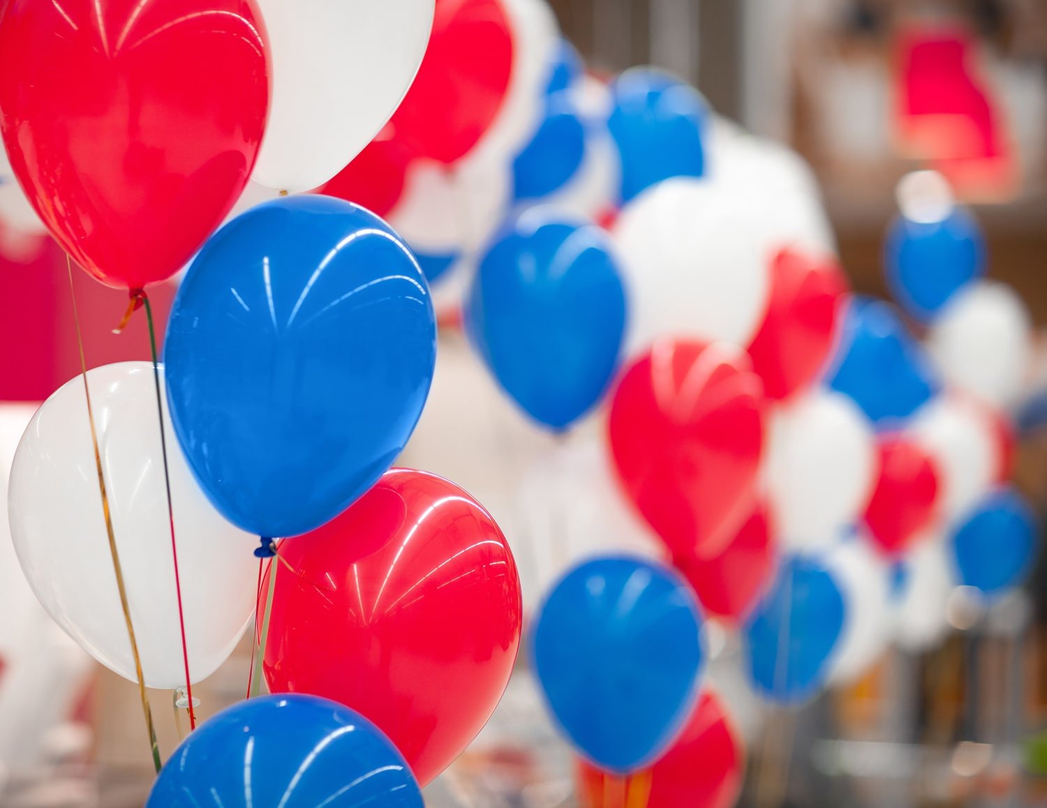 Red, white, and blue balloons at a Minute to Win It Games birthday party